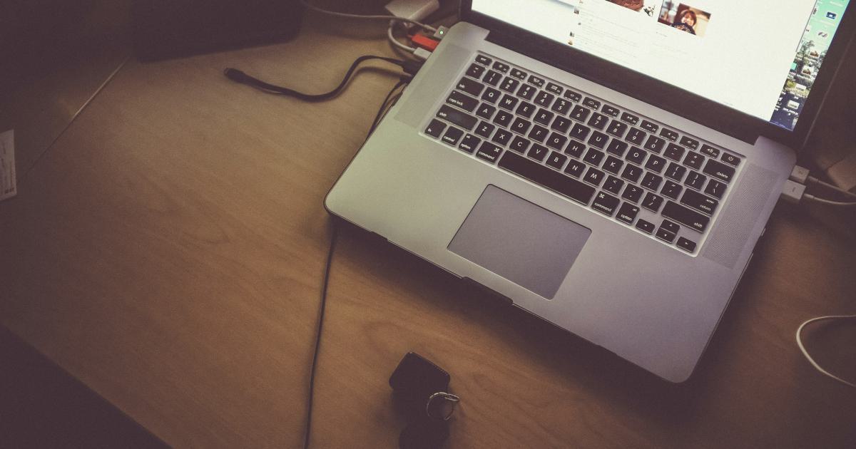 Blogger Writing on Laptop
