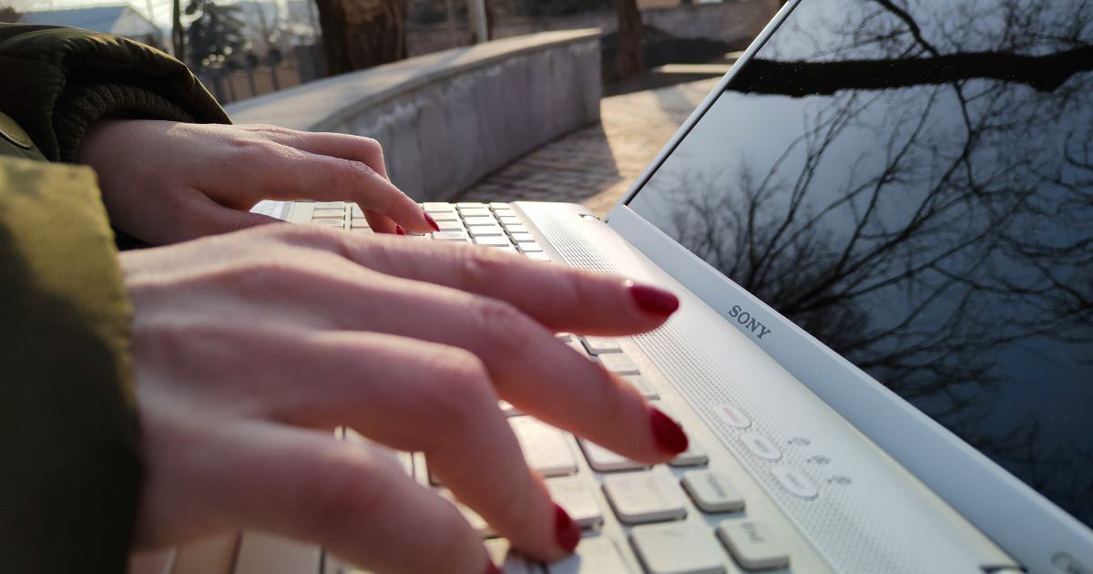 Person typing on a laptop