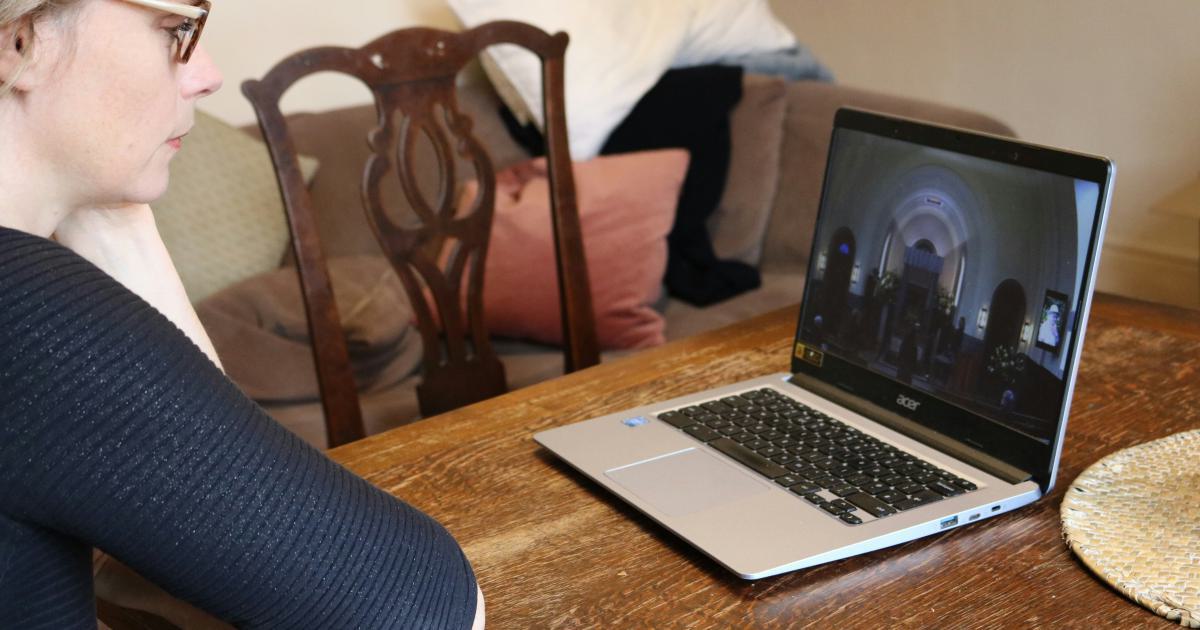 Person Watching Video on Laptop