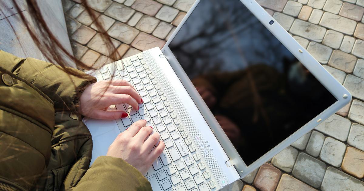 Businesswoman Typing on Laptop