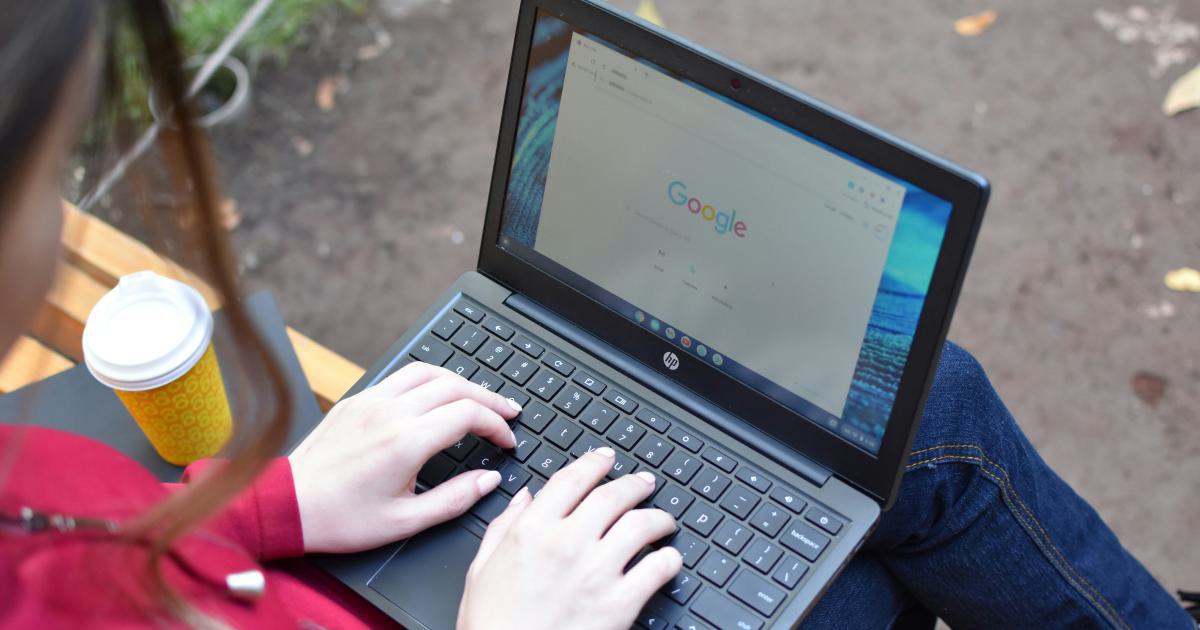 Hands Typing on Laptop