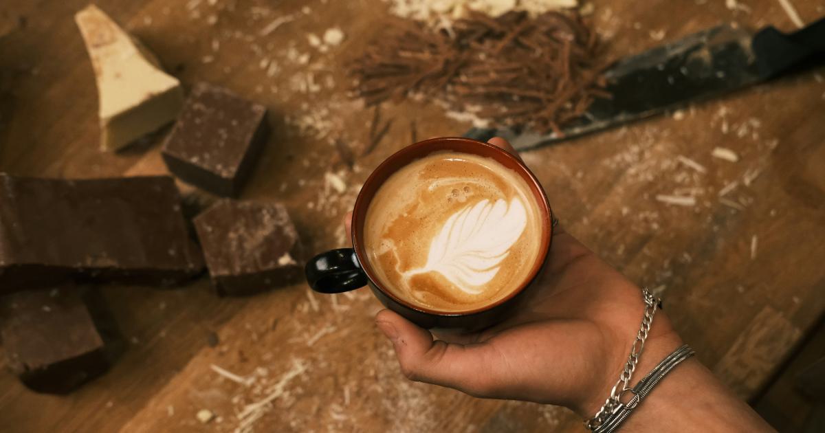 Hands Holding Coffee Cup