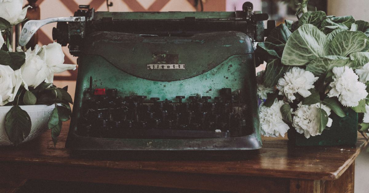 Blogger Typing on Laptop