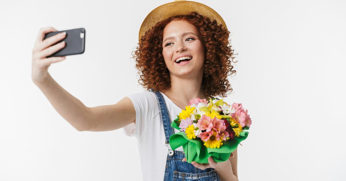 Enthusiastic woman taking a selfie