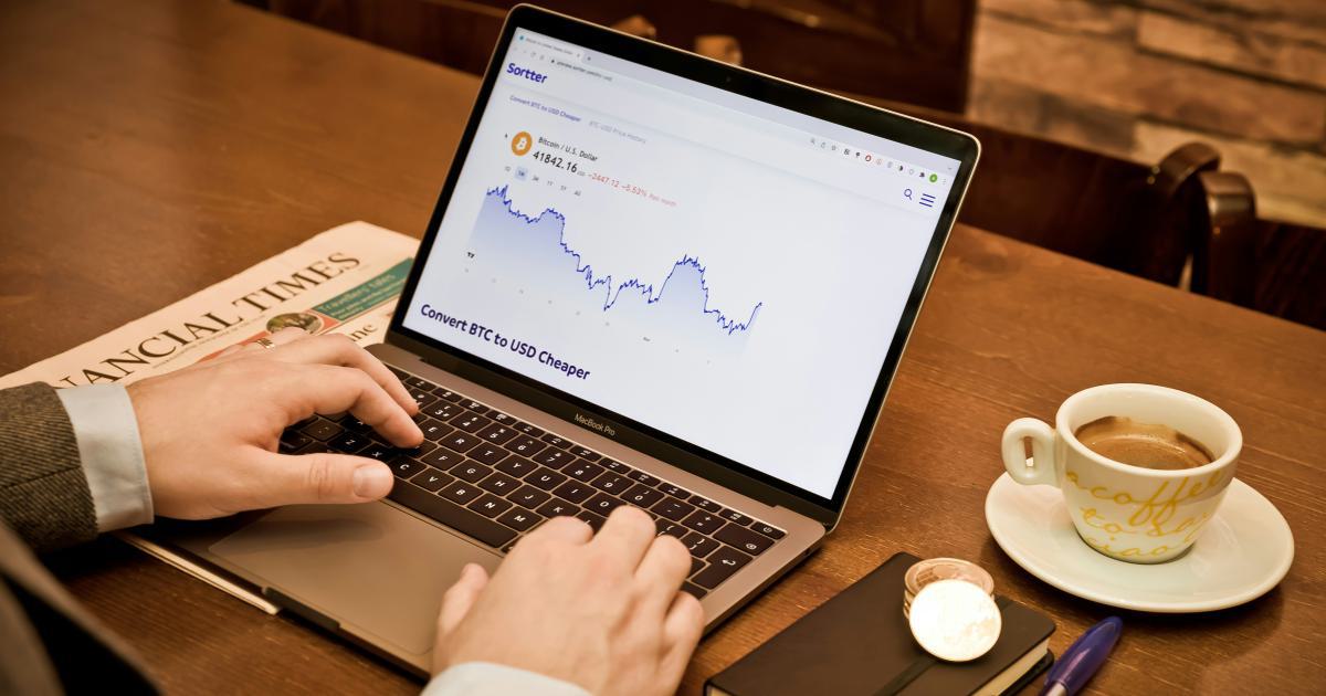 Businessman Analyzing Data on Laptop