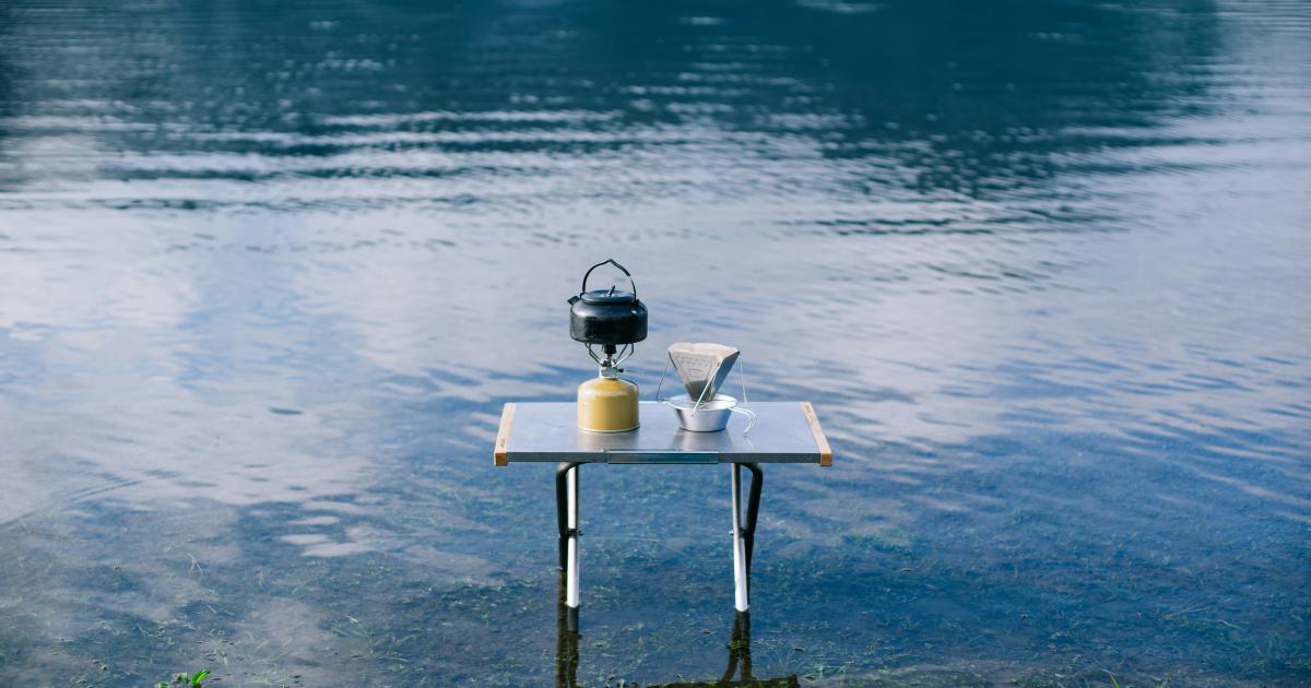 Camping Gear on Wooden Table