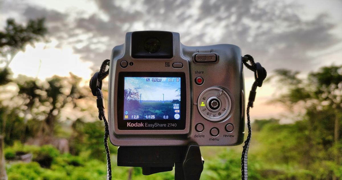 Digital Camera on Wooden Table