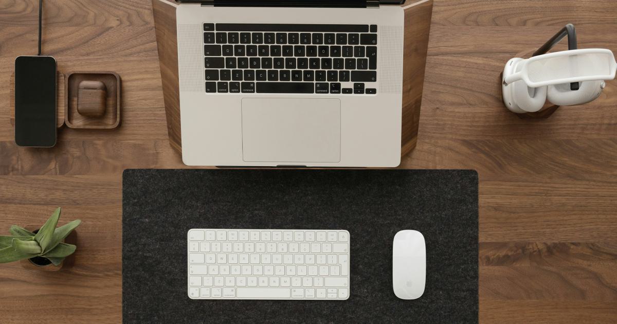 Desk with Laptop, Notebook and Office Supplies