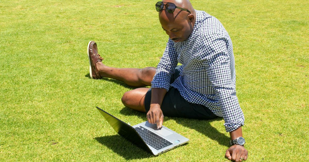 Businessman Analyzing Data on Laptop