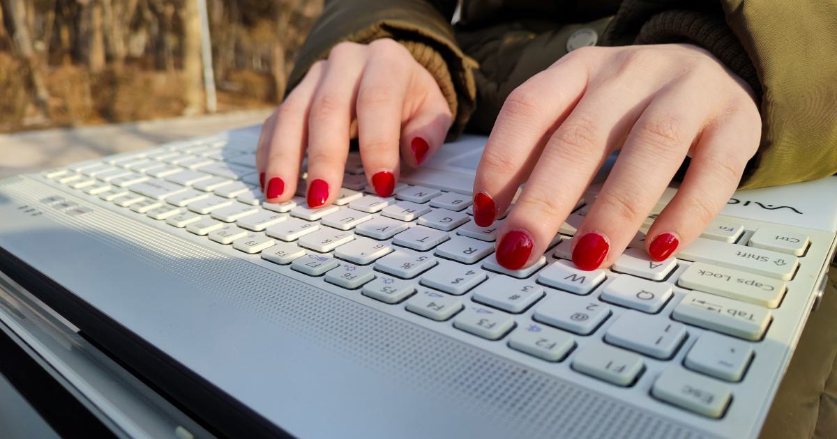 Businesswoman Typing on Laptop