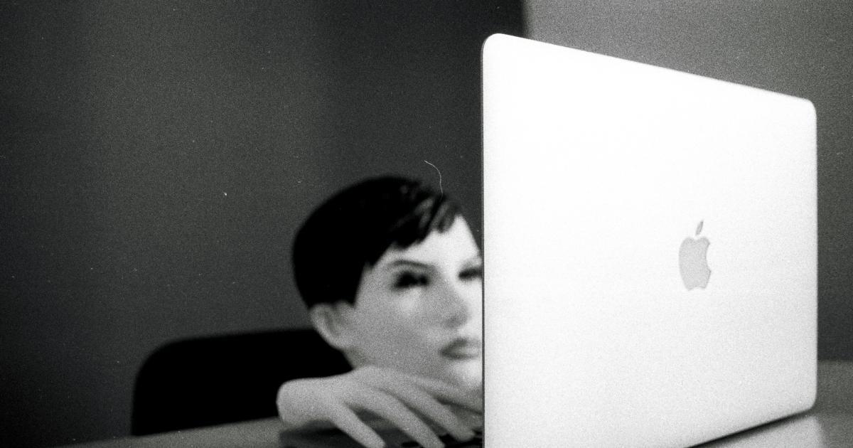 Woman Searching on Laptop